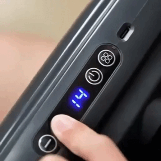 Wave Massage Gun in use on lower back for deep muscle relaxation and everyday recovery support