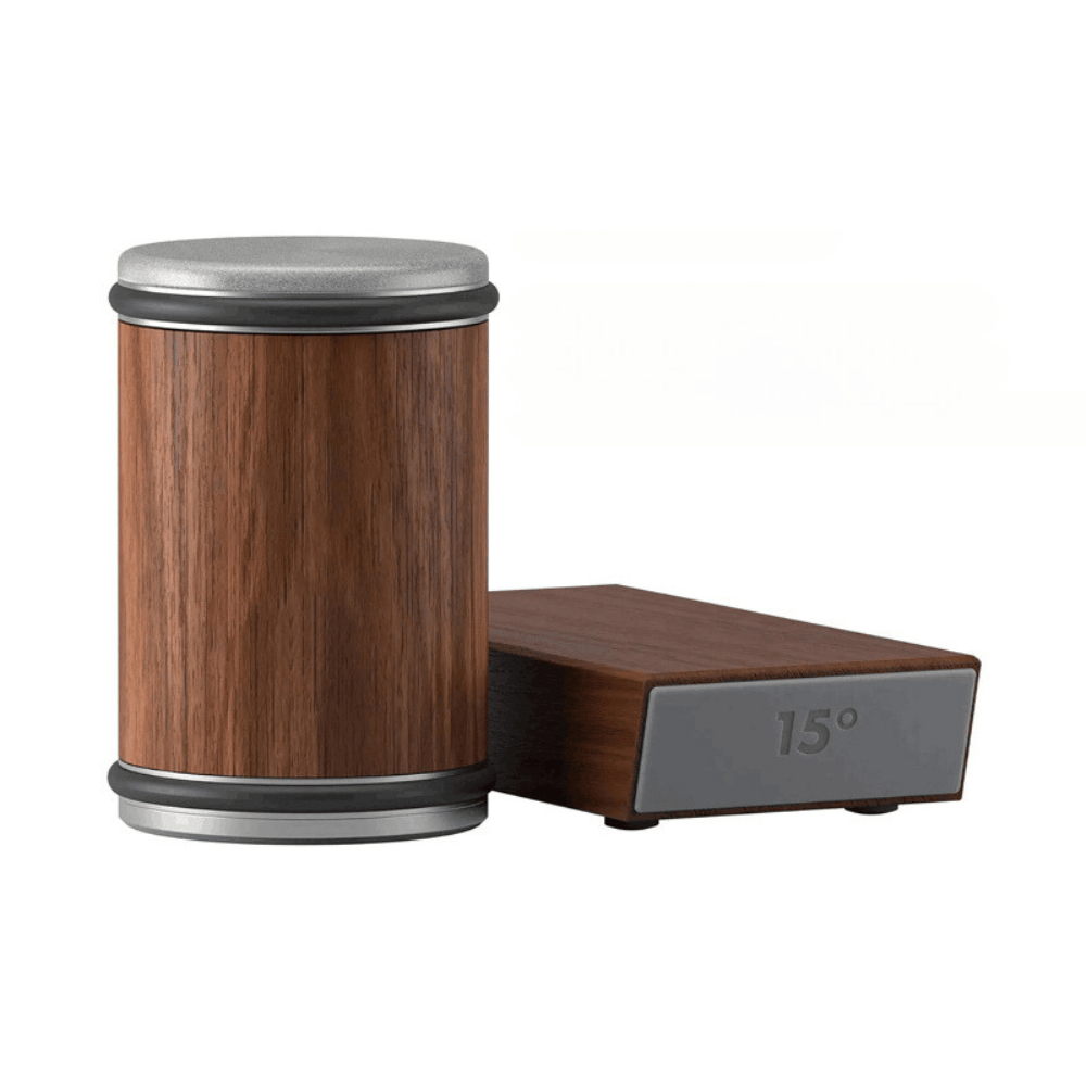 Wooden container with metallic top and base on a white background